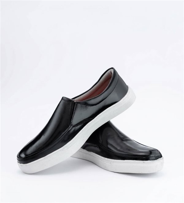 Black slip-on shoes with white soles